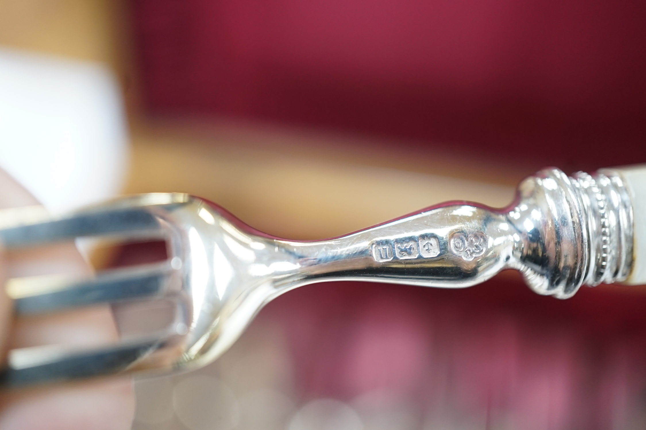 Six pairs of George V mother of pearl handled silver dessert eaters, Elkington & Co, Birmingham, 1912 and a cased set of twelve pairs of mother of pearl handled silver plated dessert eaters.